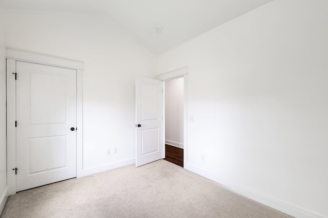 926 Acklen Ave Unit A, Nashville, TN 37203 - unfurnished bedroom with baseboards, carpet flooring, and lofted ceiling