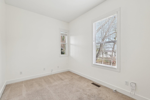 926 Acklen Ave Unit A, Nashville, TN 37203 - spare room with visible vents, baseboards, and carpet flooring