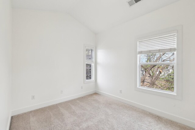 926 Acklen Ave Unit A, Nashville, TN 37203 - carpeted spare room featuring visible vents, baseboards, and vaulted ceiling