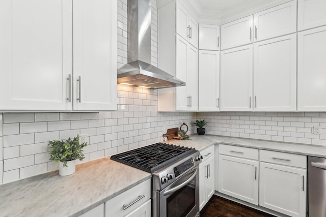 926 Acklen Ave Unit A, Nashville, TN 37203 - kitchen featuring wall chimney range hood, decorative backsplash, and appliances with stainless steel finishes