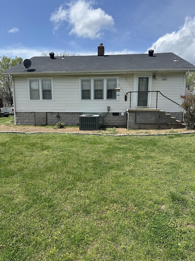 309 3rd Ave Unit 40, Fayetteville, TN 37334 - back of property with cooling unit, a yard, and a chimney