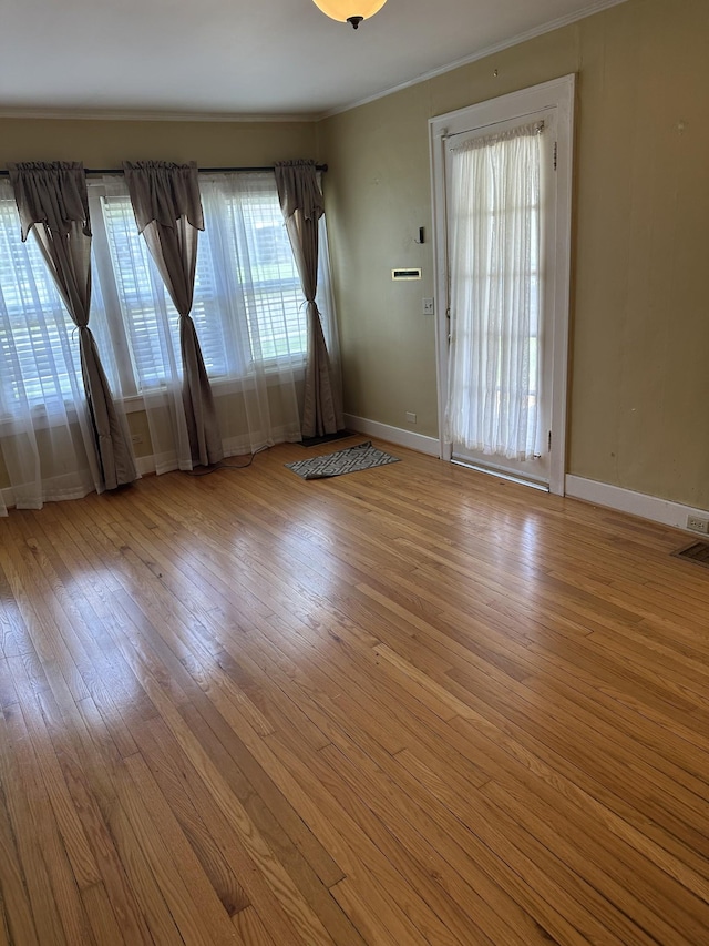 309 3rd Ave Unit 40, Fayetteville, TN 37334 - unfurnished room with crown molding, wood-type flooring, baseboards, and visible vents