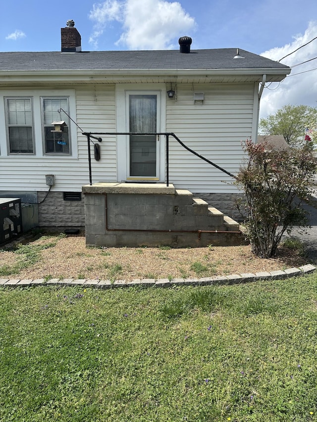 309 3rd Ave Unit 40, Fayetteville, TN 37334 - back of property with roof with shingles, a chimney, and a lawn