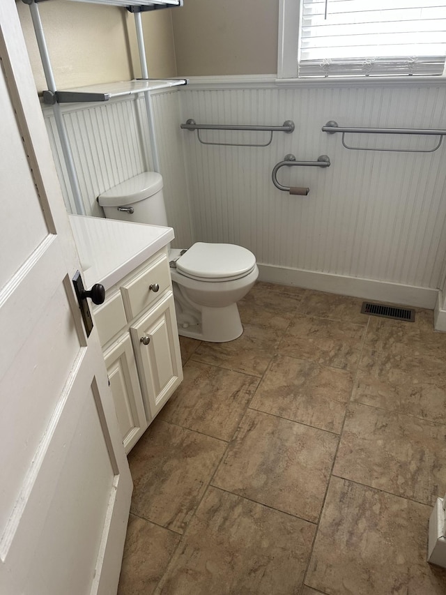 309 3rd Ave Unit 40, Fayetteville, TN 37334 - half bath featuring visible vents, toilet, vanity, and a wainscoted wall