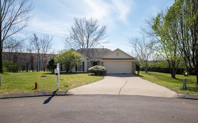 view of front facade featuring an attached garage, driveway, and a front lawn
