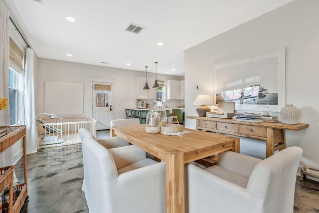 dining area with plenty of natural light and recessed lighting