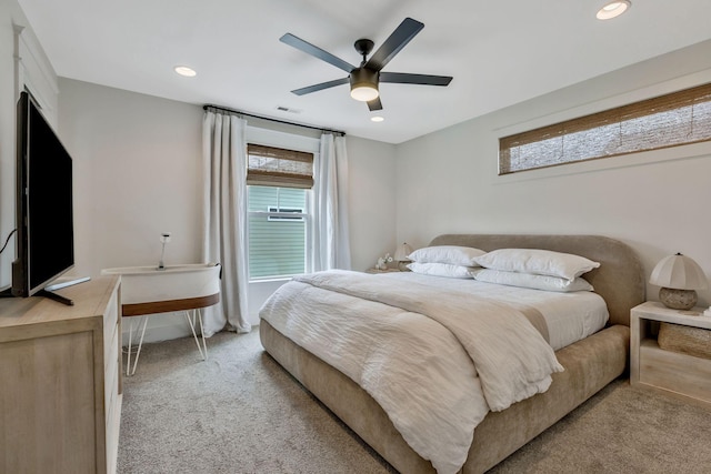 bedroom with light carpet, multiple windows, recessed lighting, and a ceiling fan