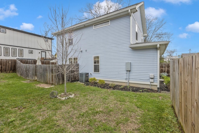 rear view of property featuring central AC unit
