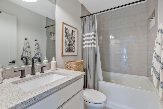 bathroom with shower / tub combo with curtain, toilet, and vanity