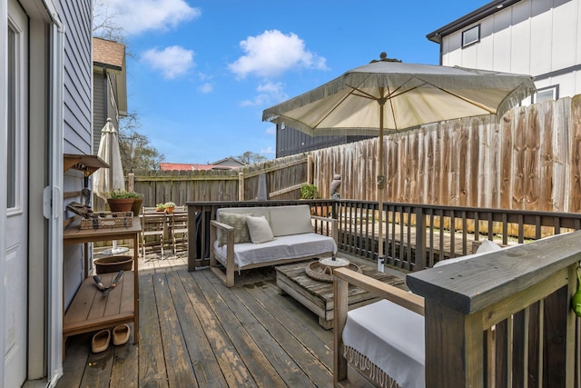 deck with fence and outdoor lounge area