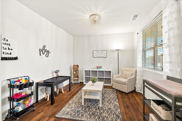 1428 Marigold Dr, Spring Hill, TN 37174 - living area featuring dark wood-type flooring, visible vents, and baseboards