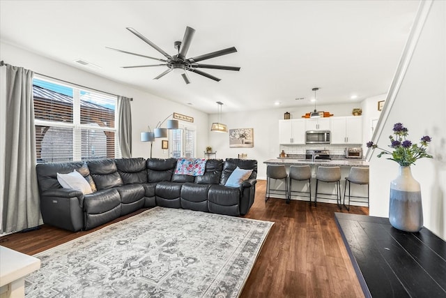 1428 Marigold Dr, Spring Hill, TN 37174 - living room featuring dark wood-style floors, a toaster, a ceiling fan, and visible vents