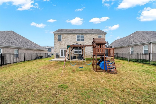1428 Marigold Dr, Spring Hill, TN 37174 - rear view of property featuring a patio area, brick siding, a fenced backyard, a playground, and a lawn