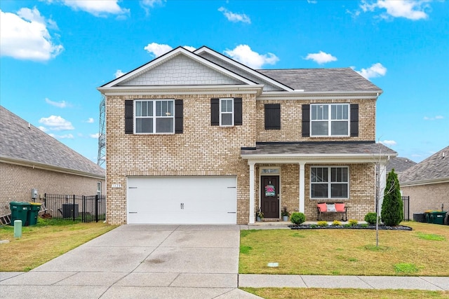 1428 Marigold Dr, Spring Hill, TN 37174 - view of front of property featuring a front yard, an attached garage, brick siding, and concrete driveway