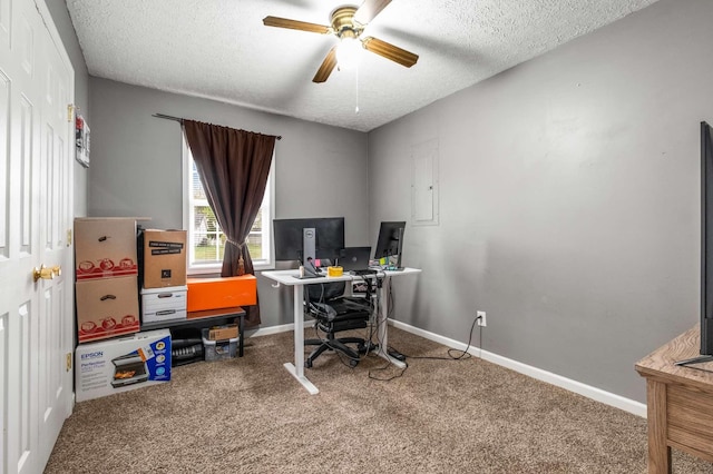 office with a textured ceiling, ceiling fan, and carpet flooring