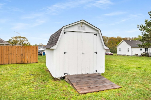view of shed with fence