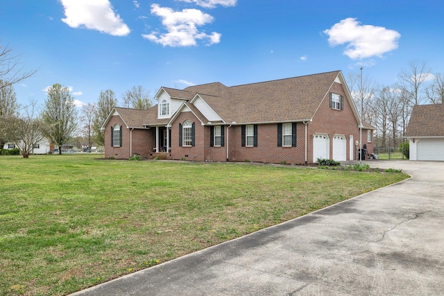 view of front of house featuring a shingled roof, an attached garage, concrete driveway, brick siding, and a front lawn
