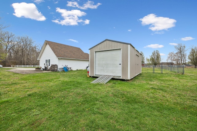 view of shed featuring fence