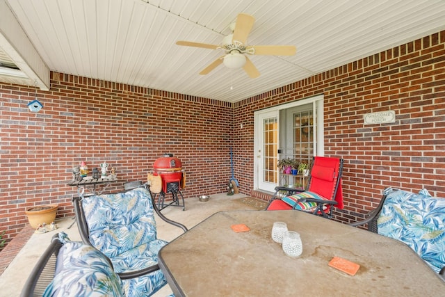view of patio featuring ceiling fan