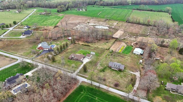 birds eye view of property with a rural view