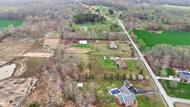 birds eye view of property featuring a forest view and a rural view