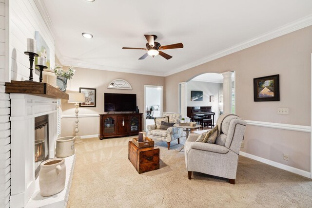 2009 Cedarmont Dr, Franklin, TN 37067 - living room featuring a ceiling fan, crown molding, a brick fireplace, arched walkways, and carpet