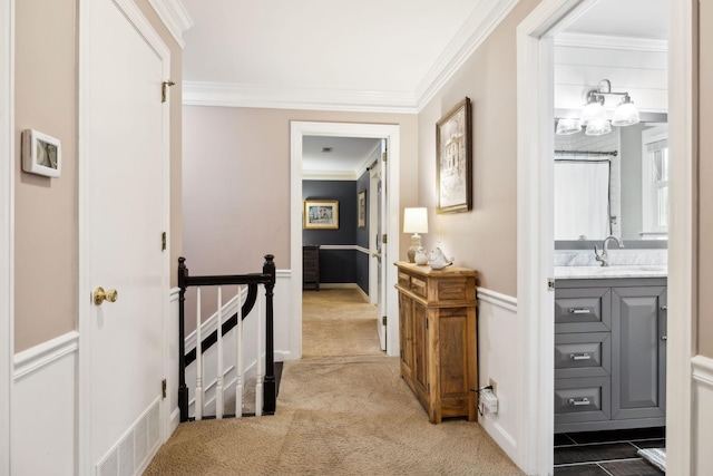 2009 Cedarmont Dr, Franklin, TN 37067 - hall with visible vents, a sink, ornamental molding, an upstairs landing, and carpet floors