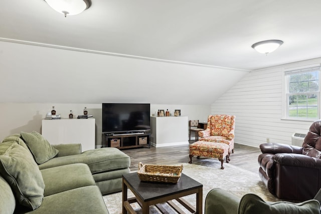 2009 Cedarmont Dr, Franklin, TN 37067 - living area with an AC wall unit, vaulted ceiling, and wood finished floors