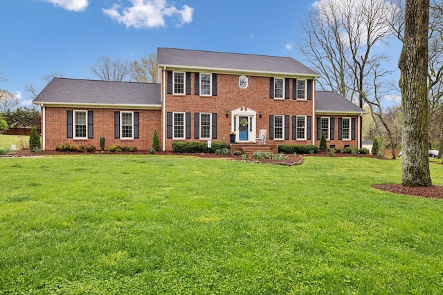2009 Cedarmont Dr, Franklin, TN 37067 - colonial house with a shingled roof, a front yard, and brick siding