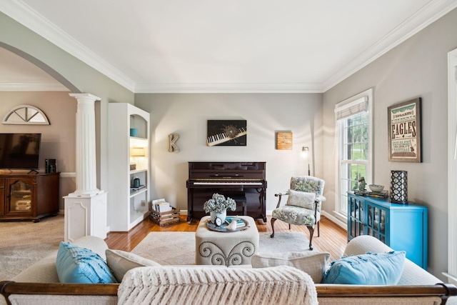 2009 Cedarmont Dr, Franklin, TN 37067 - living room with baseboards, arched walkways, ornamental molding, decorative columns, and wood finished floors