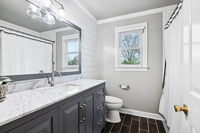 2009 Cedarmont Dr, Franklin, TN 37067 - full bath featuring crown molding, vanity, toilet, wood tiled floor, and baseboards