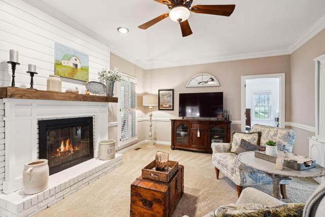 2009 Cedarmont Dr, Franklin, TN 37067 - carpeted living room featuring crown molding, a ceiling fan, plenty of natural light, and a brick fireplace