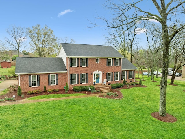 2009 Cedarmont Dr, Franklin, TN 37067 - colonial home with a shingled roof, brick siding, and a front lawn