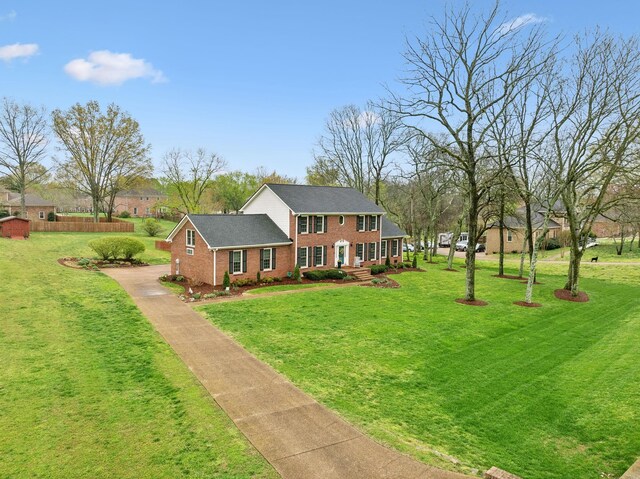 2009 Cedarmont Dr, Franklin, TN 37067 - view of front of house with brick siding, driveway, and a front lawn