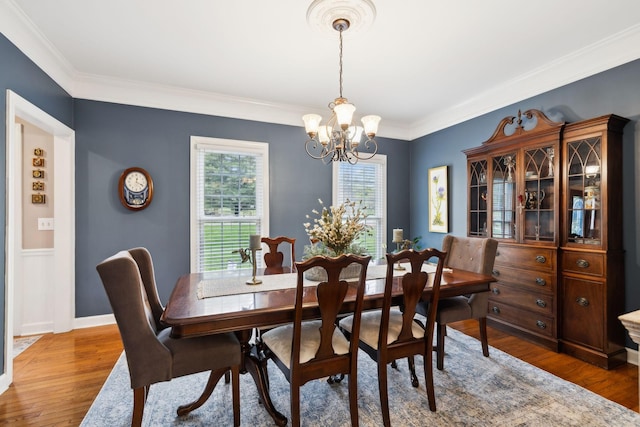 2009 Cedarmont Dr, Franklin, TN 37067 - dining area with crown molding, baseboards, a notable chandelier, and wood finished floors