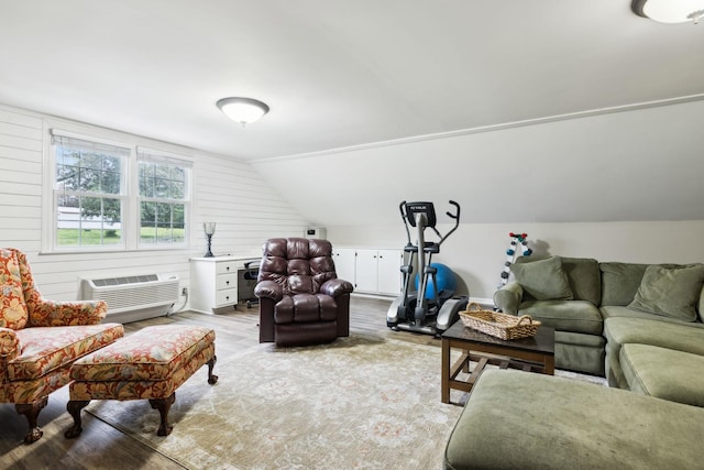 2009 Cedarmont Dr, Franklin, TN 37067 - living room with light wood finished floors, a wall mounted air conditioner, and vaulted ceiling