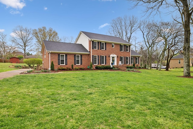 2009 Cedarmont Dr, Franklin, TN 37067 - view of front of property featuring driveway, a front yard, and brick siding