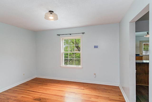 740 Kleeman Dr, Clarksville, TN 37040 - unfurnished room with light wood finished floors, baseboards, and a healthy amount of sunlight