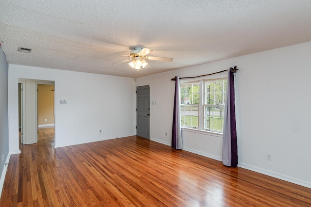 740 Kleeman Dr, Clarksville, TN 37040 - spare room featuring wood finished floors, a textured ceiling, baseboards, and ceiling fan