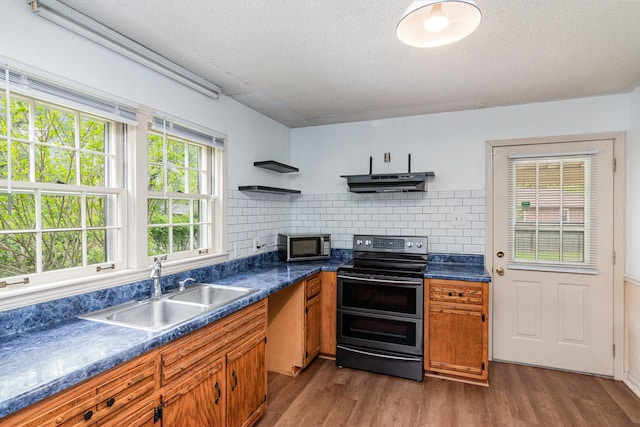 740 Kleeman Dr, Clarksville, TN 37040 - kitchen featuring stainless steel appliances, a sink, dark wood-style flooring, open shelves, and under cabinet range hood