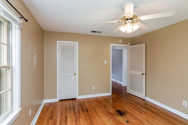 740 Kleeman Dr, Clarksville, TN 37040 - unfurnished bedroom featuring wood finished floors, visible vents, and baseboards
