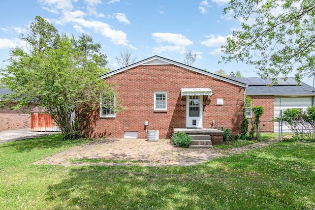 740 Kleeman Dr, Clarksville, TN 37040 - back of property with a lawn, central AC unit, brick siding, and fence