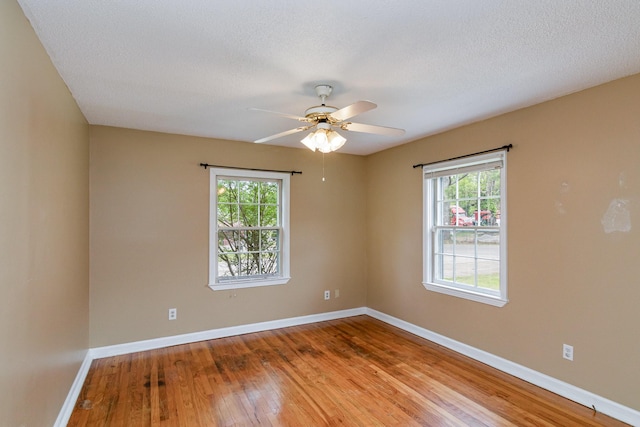 740 Kleeman Dr, Clarksville, TN 37040 - spare room with baseboards, a wealth of natural light, ceiling fan, and wood-type flooring