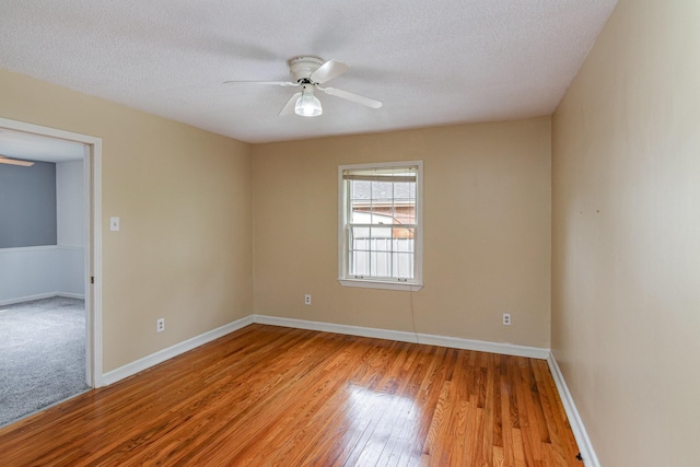 740 Kleeman Dr, Clarksville, TN 37040 - unfurnished room featuring baseboards, a ceiling fan, wood finished floors, and a textured ceiling
