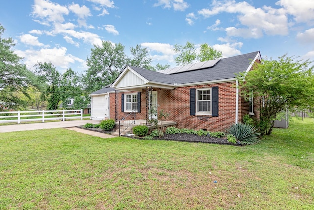 740 Kleeman Dr, Clarksville, TN 37040 - ranch-style home featuring a front lawn, driveway, brick siding, and solar panels