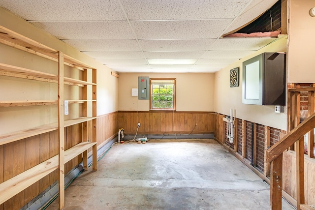 740 Kleeman Dr, Clarksville, TN 37040 - below grade area with wooden walls, a wainscoted wall, electric panel, and a drop ceiling