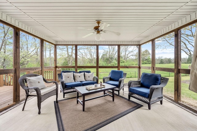 sunroom with an outdoor hangout area and ceiling fan