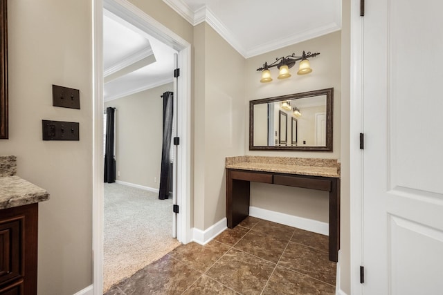 corridor featuring crown molding, baseboards, and dark colored carpet