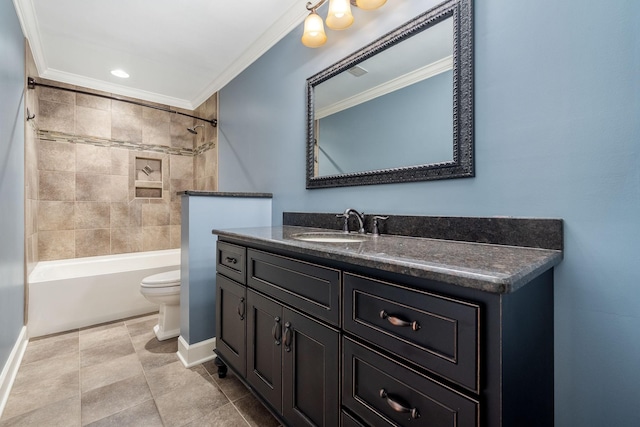 bathroom with vanity, ornamental molding, toilet, washtub / shower combination, and baseboards