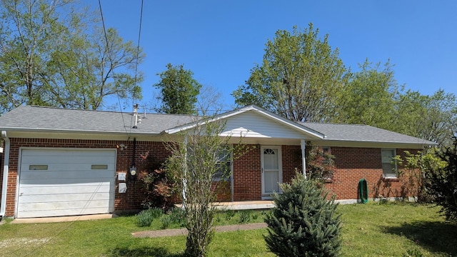 206 Birchwood Dr, Columbia, TN 38401 - single story home featuring a garage, brick siding, a front lawn, and covered porch